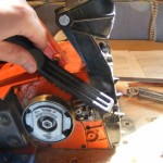 cleaning the saw with a stiff nylon brush
